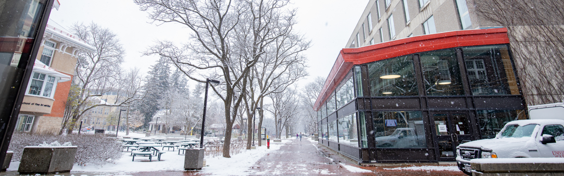 The path in front of the university centre on a snowy day.