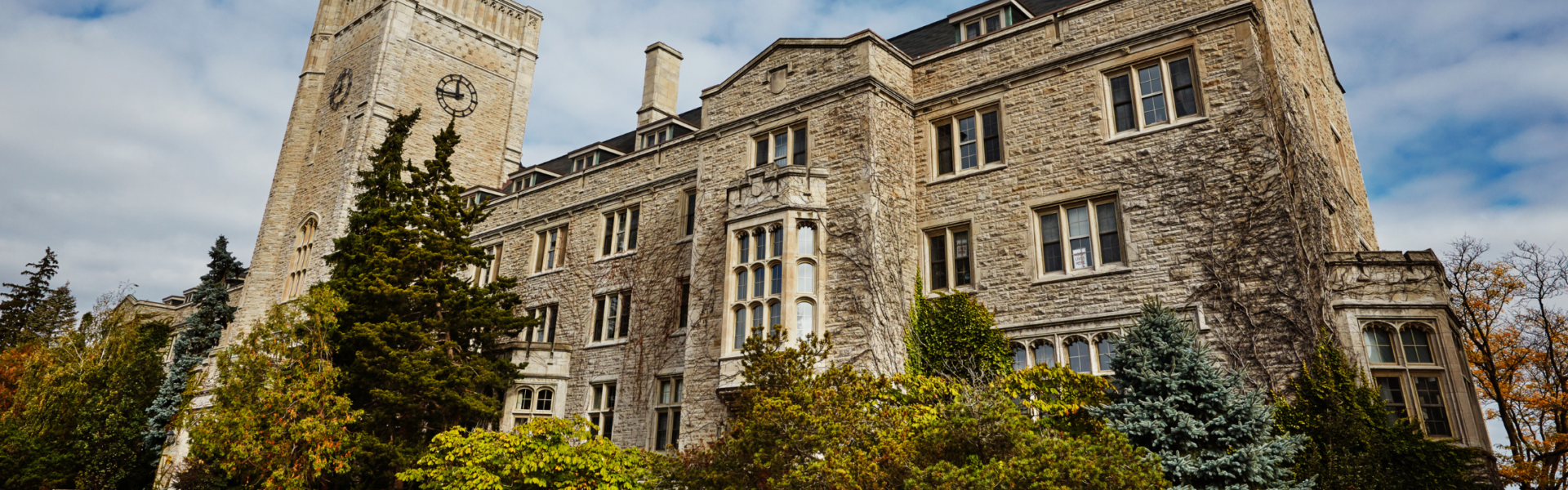 Johnston Hall against a partly cloudy sky.