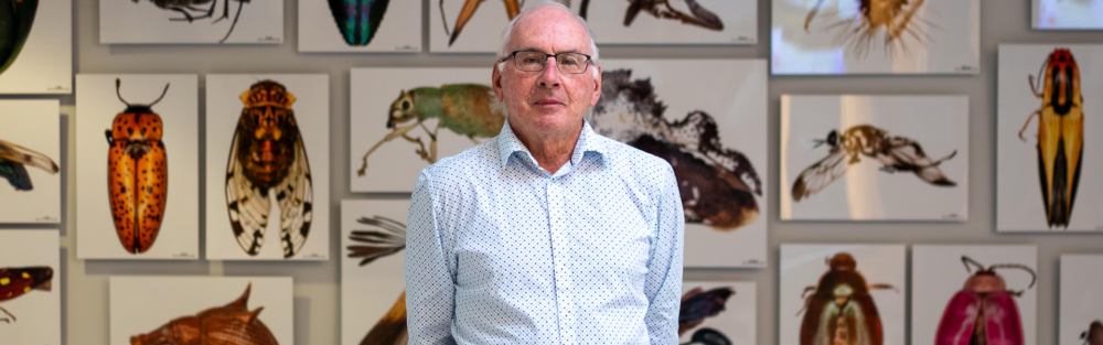 Dr. Paul Hebert in front of insects.