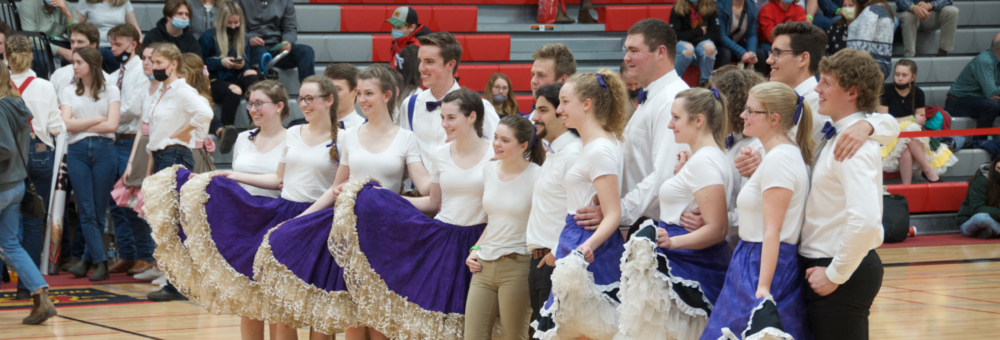 A group of contestants in the College Royal Square Dance competition pose for a group photo.