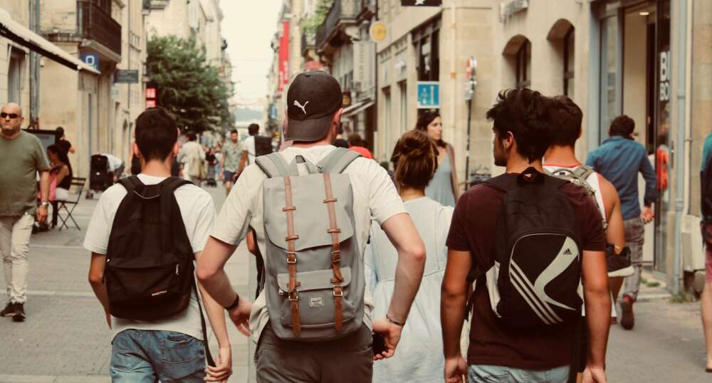 group of people walking on european street