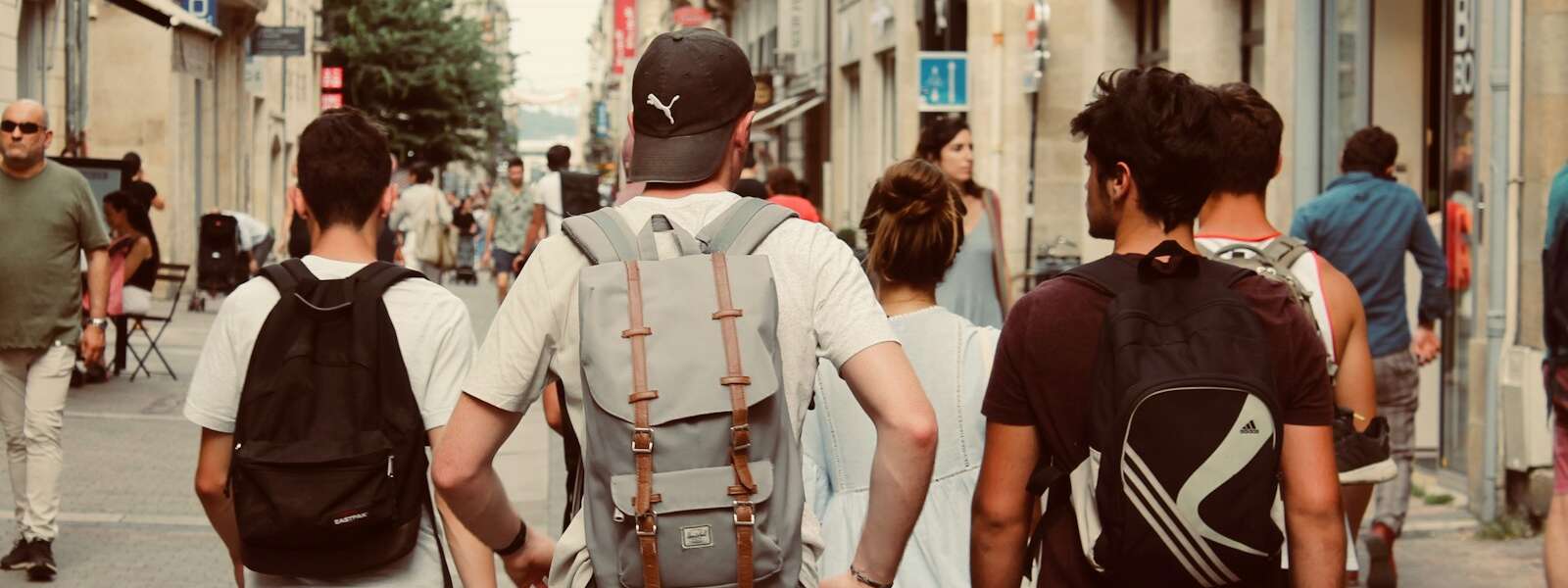 group of people walking on european street