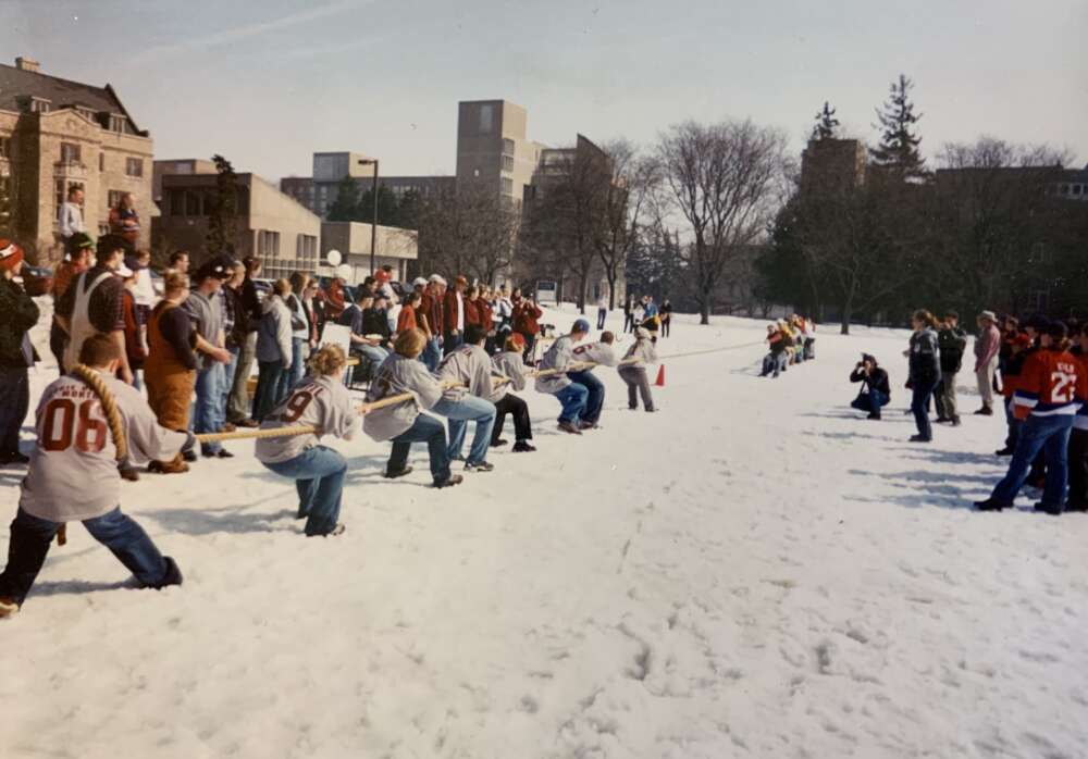 Students pulling rope in College Royal tug of war on snowy field, 2004