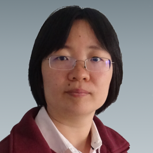 Huiyan Li faces the camera, wearing a red zip up sweater and a collared shirt.