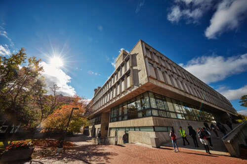 The U of G library against a sunny blue sky.