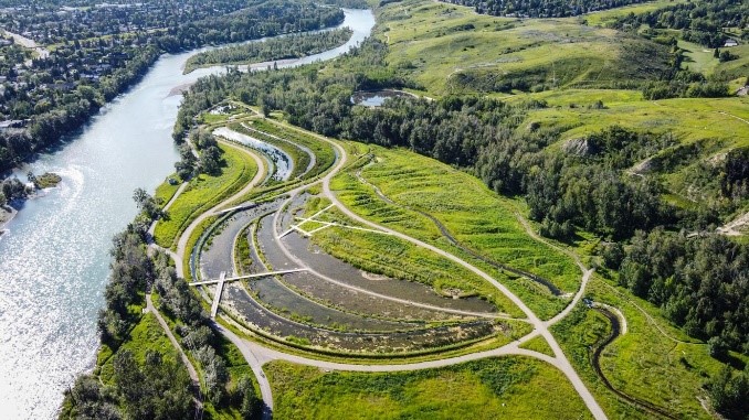 Dale Hodges Park, a park by a river with intersecting foot paths and surrounded by forest.