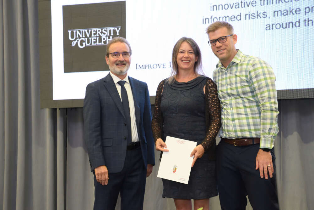 Alison Crear poses with her award, Rene Van Acker and Clarke Mathany.