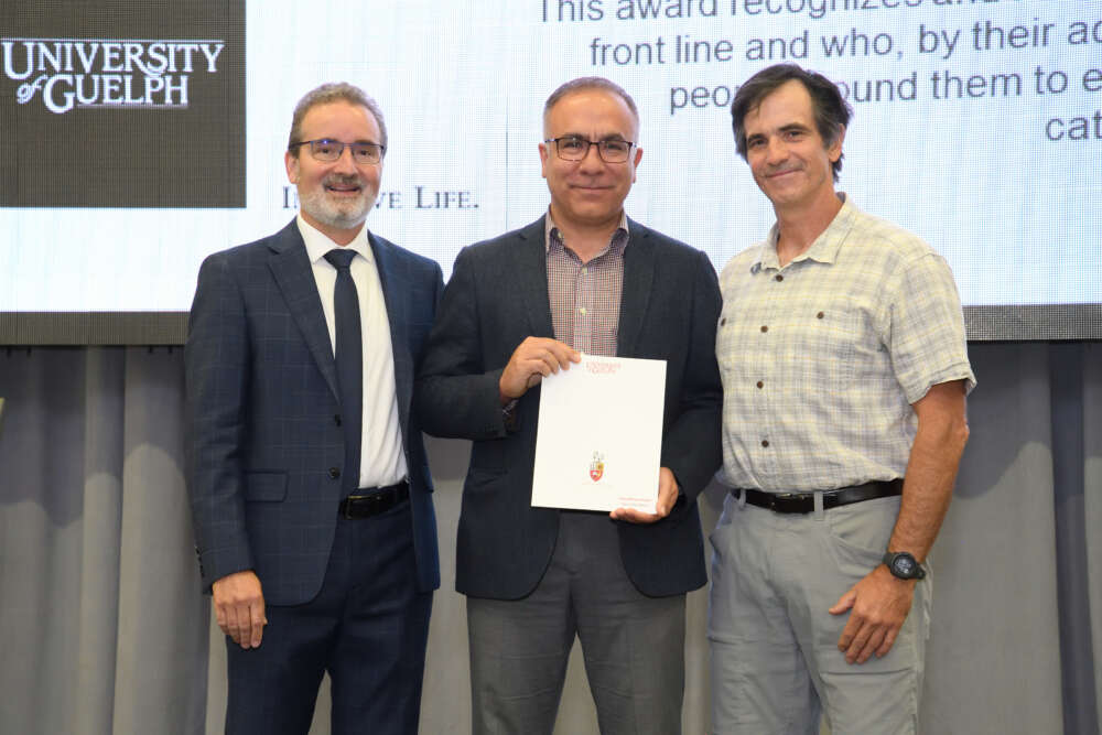 Saeed Mirzaee Ghazani poses with Rene Van Acker and Alejandro Marangoni.