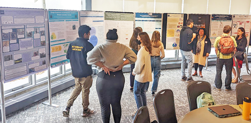 Students look at posters at One Health Research Day.