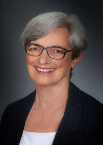 Valerie Davidson headshot. She has short grey hear and is wearing a black blazer.