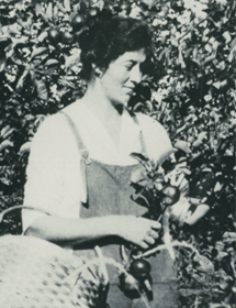 Susannah Steckle picking flowers in a black and white photo.