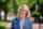 Headshot of Dr. Charlotte Yates outside on University campus, wearing a blazer and collared shirt.