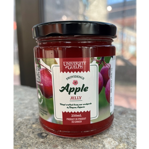 A jar of Providence crabapple jelly, featuring photos of an apple tree on the label.