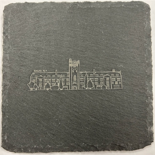 A slate coaster with a drawing of johnston hall.