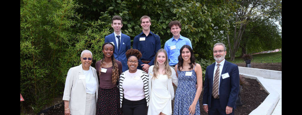 seven students pose outside with U of G Chancellor Mary-Anne Chambers and President Rene van Acker
