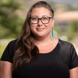 Dr. Jesse Popp smiles while posing outside