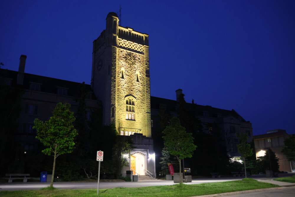 Johnston Hall lit yellow.