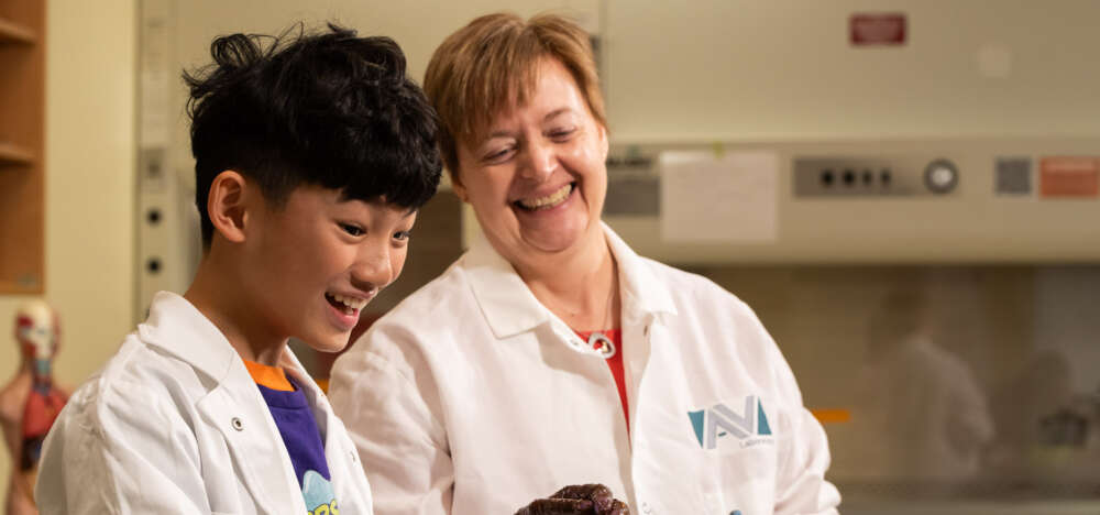 people in lab coats in a lab