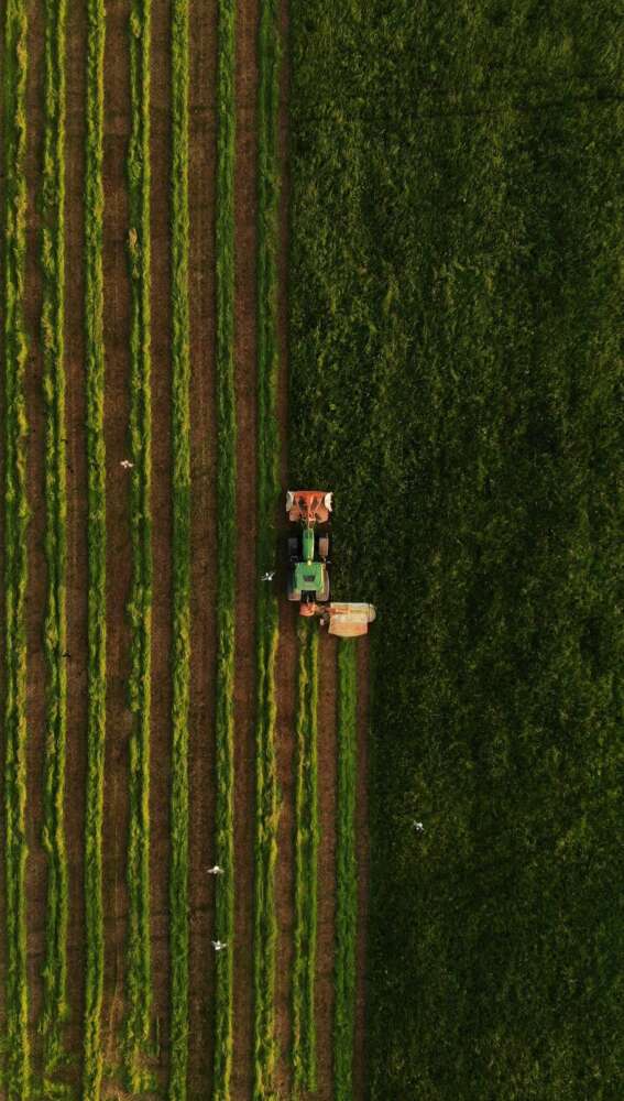 Aerial view of tractor plowing a field