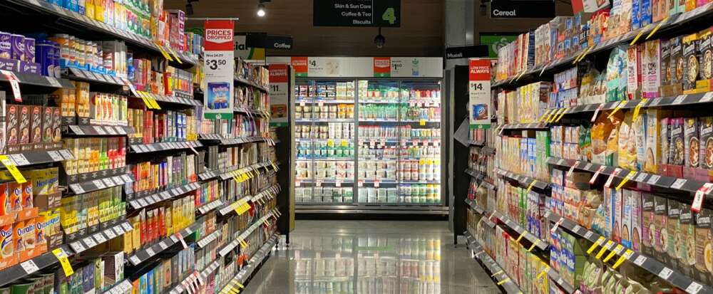 white and red labeled pack on white shelf