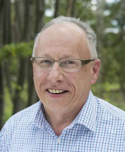 Headshot of Peter Conlon, wearing a blue checked shirt