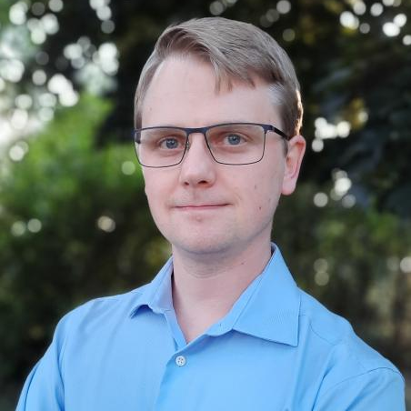 person in blue shirt poses for headshot