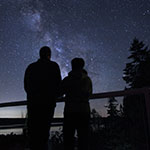 Two people stargazing